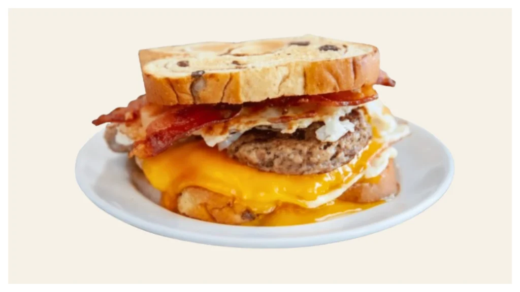 Waffle House sausage, egg, and cheese sandwich on toasted raisin bread